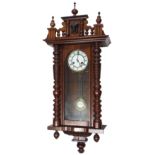 Small walnut two train Vienna regulator wall clock, the 5" white dial within a ring turned