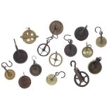 Twelve Longcase clock pulleys and three regulator pulleys; also six pairs of pulleys