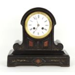 Small attractive French black slate and red marble two train mantel clock striking on a bell, the