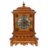 Good English light oak triple fusee chiming gothic clock, the 7.5" silvered chapter ring signed J.W.