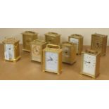 Nine various contemporary carriage type clocks all within brushed brass cases, tallest 6" high (9)