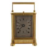 Good French ormolu carriage clock striking on a gong, the silvered engine turned dial signed Garnier