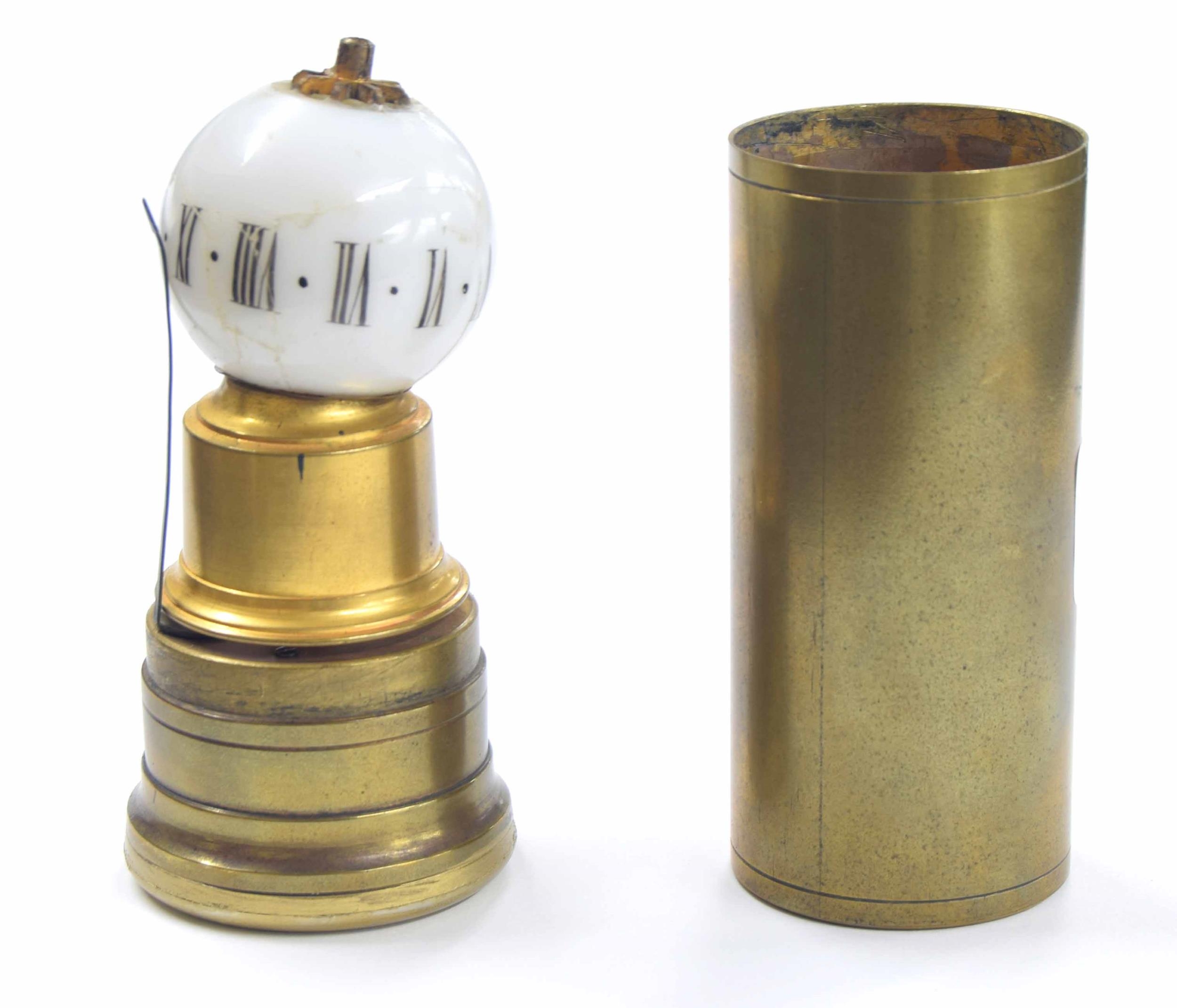 Interesting miniature cylindrical brass night clock with globular opaque glass shade inscribed