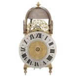 Continental brass lantern clock, the 6.75? silvered dial enclosing a foliate engraved centre,