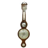 Mahogany five glass wheel barometer signed Negretti & Zambra, 11 Hatton Garden, London, the