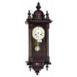 Small faux rosewood Vienna style two train wall clock with musical movement, the 4" white dial