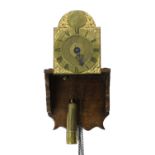 Interesting early English miniature brass verge wall clock with alarm, the 5" brass arched dial