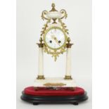 French ormolu and white marble two train drumhead portico mantel clock, the Samuel Marti movement