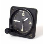 Lemania Nero mosquito 8-day cockpit clock, the 2" signed dial within a square black metal casing,