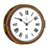 Bulkhead ships clock, the 8" white dial with subsidiary seconds dial, within a heavy brass case (