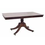 19th century mahogany rectangular tilt-top breakfast table, the plain top upon turned pedestal