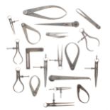 Selection of vintage metal gauging tools, primarily outside callipers