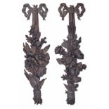 Pair of carved fruitwood wall hangings in the manner of Grinling Gibbons, modelled with flowers,