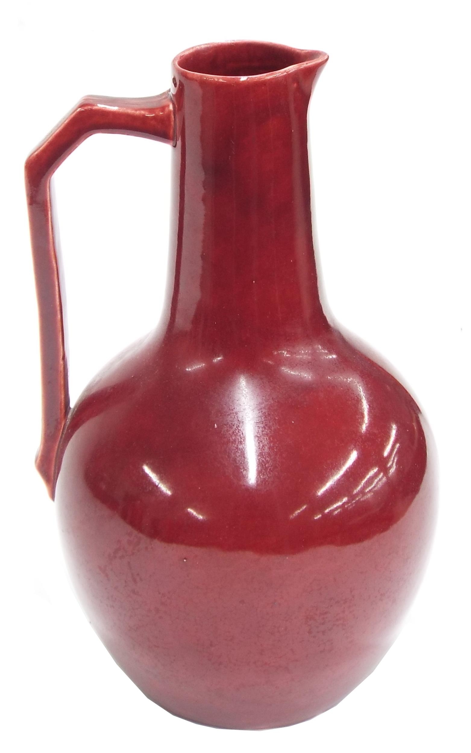 Christopher Dresser design for Lear Pottery jug, decorated in a deep ruby red glaze, inscribed