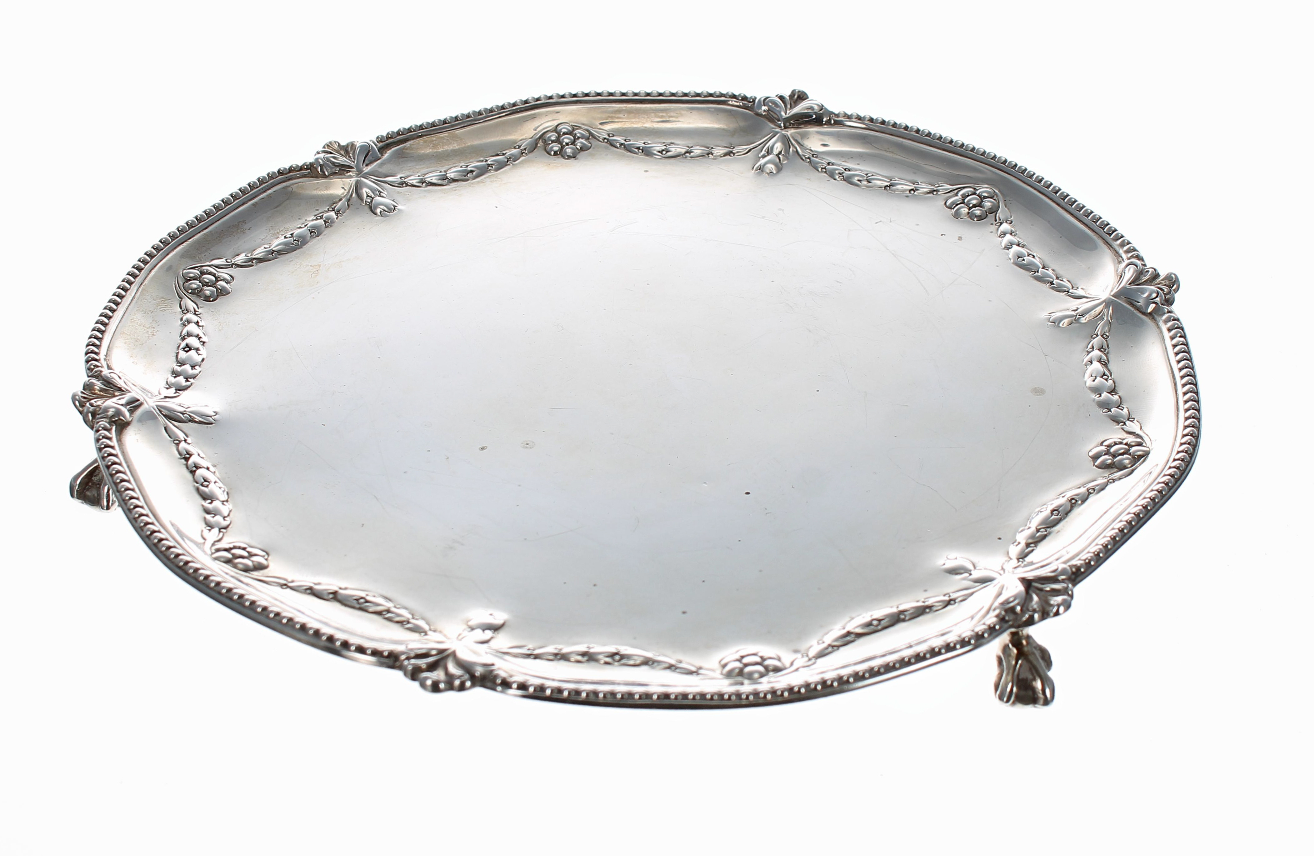 Victorian silver card tray, repousse decorated with foliate swag borders within a beaded rim, raised