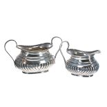 Victorian silver twin-handled sucrier and cream jug of half reeded form, maker Samuel Walton