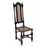 17th century style oak and cane high-backed chair, with moulded rounded arched foliate carved