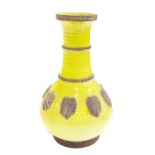 Provincial glazed Chinese stoneware vase, decorated with raised moulded roundels on a yellow glaze