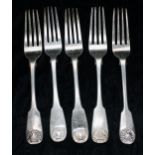Five similar Georgian and Victorian fiddle and shell pattern dinner forks, two with engraved