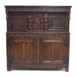 Mid 17th century and later English oak inlaid court cupboard, the upper canopied section with