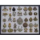 Military Regimental cap badges - collection of thirty-four examples mounted in a display frame, 16.