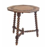 Oak nonagon side table, the moulded top with relief carved foliate scrolling border raised upon