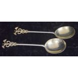 Pair of Goldsmiths & Silversmiths Co. Ltd silver spoons, the handles with Caduceus entwined