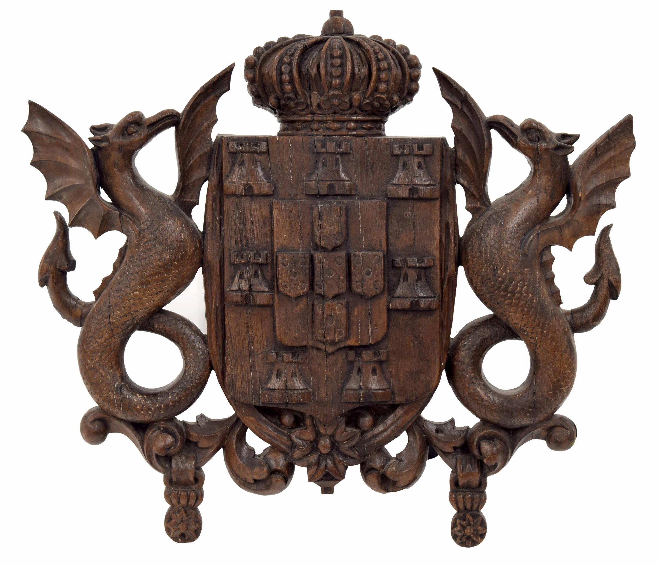 Early 18th century Portuguese armorial plaque carved with a Coat of Arms, the central shield flanked