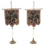 Pair of small Victorian bead embroidered face screens, on gilt metal masts raised on circular