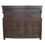 Very large Charles II Westmorland carved oak court cupboard, the moulded stepped canopied top over