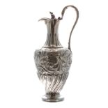 Good Victorian silver claret jug, the body repousse foliate scroll decorated within a half wrythen