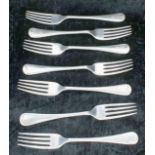 Seven James Deakin & Sons silver forks, marked Sheffield, four 1923 with monograms to the handles,