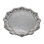 Late Victorian cast silver salver, with raised scrolling foliate border around floral and foliate