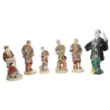 Selection of Japanese Satsuma pottery figures, modelled in various pursuits with animals and