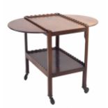 Mahogany serving/tea trolley, the top with drop flap extensions and shaped gallery border over an