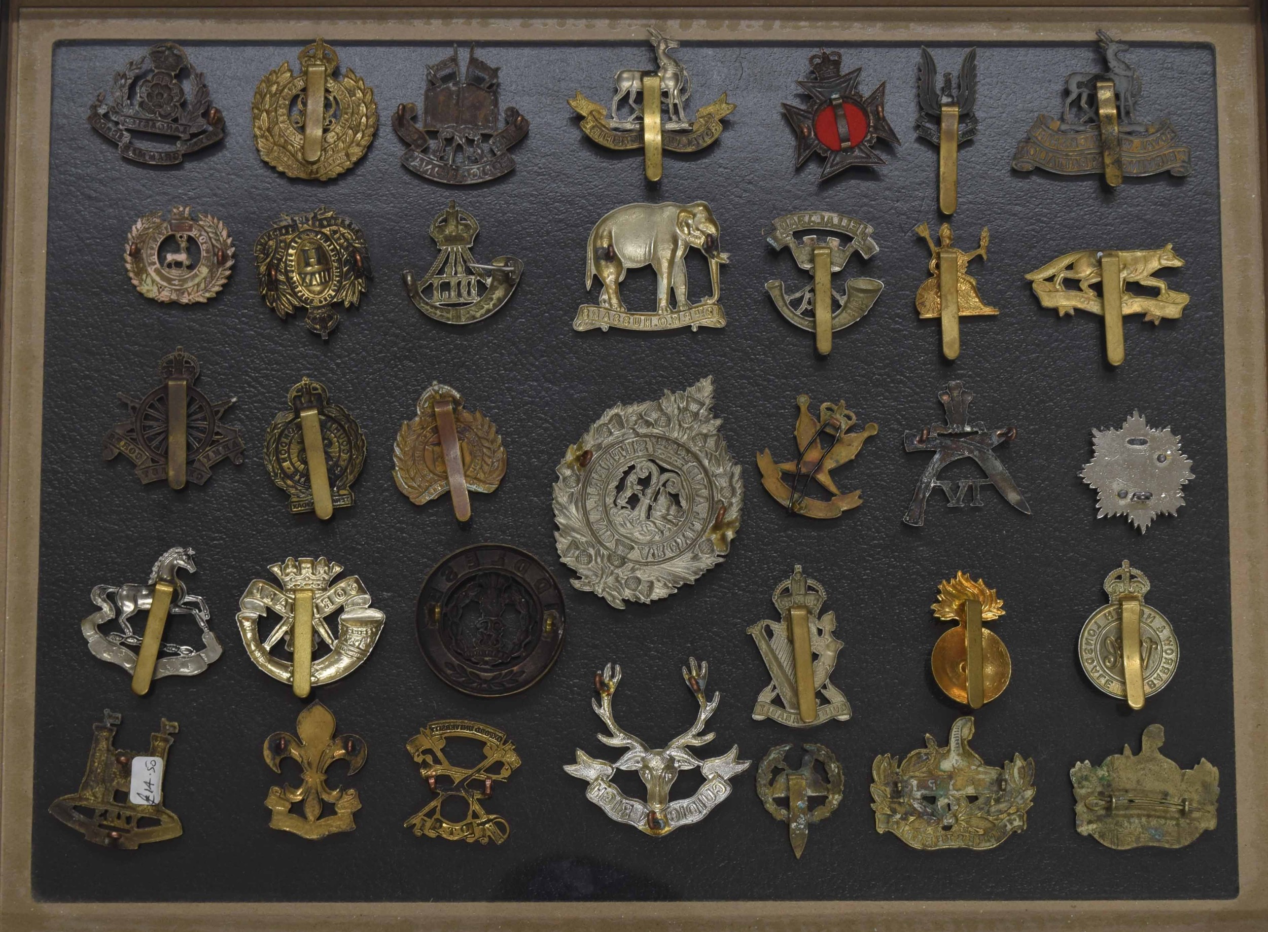 Military Regimental cap badges - collection of thirty-four examples mounted in a display frame, 16. - Image 2 of 2