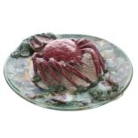 Palissy style majolica crab plate, decorated with moulded sea shells to the border and sand textured