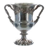 William IV silver trophy cup, with twin cast acorn handles raised upon foliate pedestal, with a