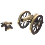 Brass mounted and wooden model cannon, barrel 8" long, wheels 8" diameter; together with a smaller