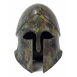 Bronze helmet after the antique, 10" high, 9" long ** provenance - Abbey House, Malmesbury,