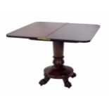 Victorian mahogany foldover tea table, the hinged top over foliate scrolled carved apron, raised