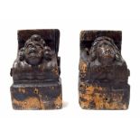 Interesting pair of early oak corbels carved with the heads of a gentleman and lady and with