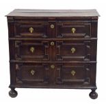 Small late 17th century English oak chest of drawers, the moulded planked top over three long