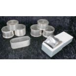 Eight assorted silver napkin rings, one in a retail box, 10oz t