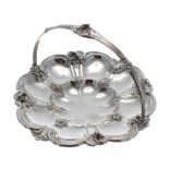 Early Victorian silver basket, with reeded and floral cast swing handle over lobed basket with