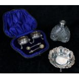 Cased pair of Victorian silver salt cellars (unrelated spoons), repousse foliate decorated with