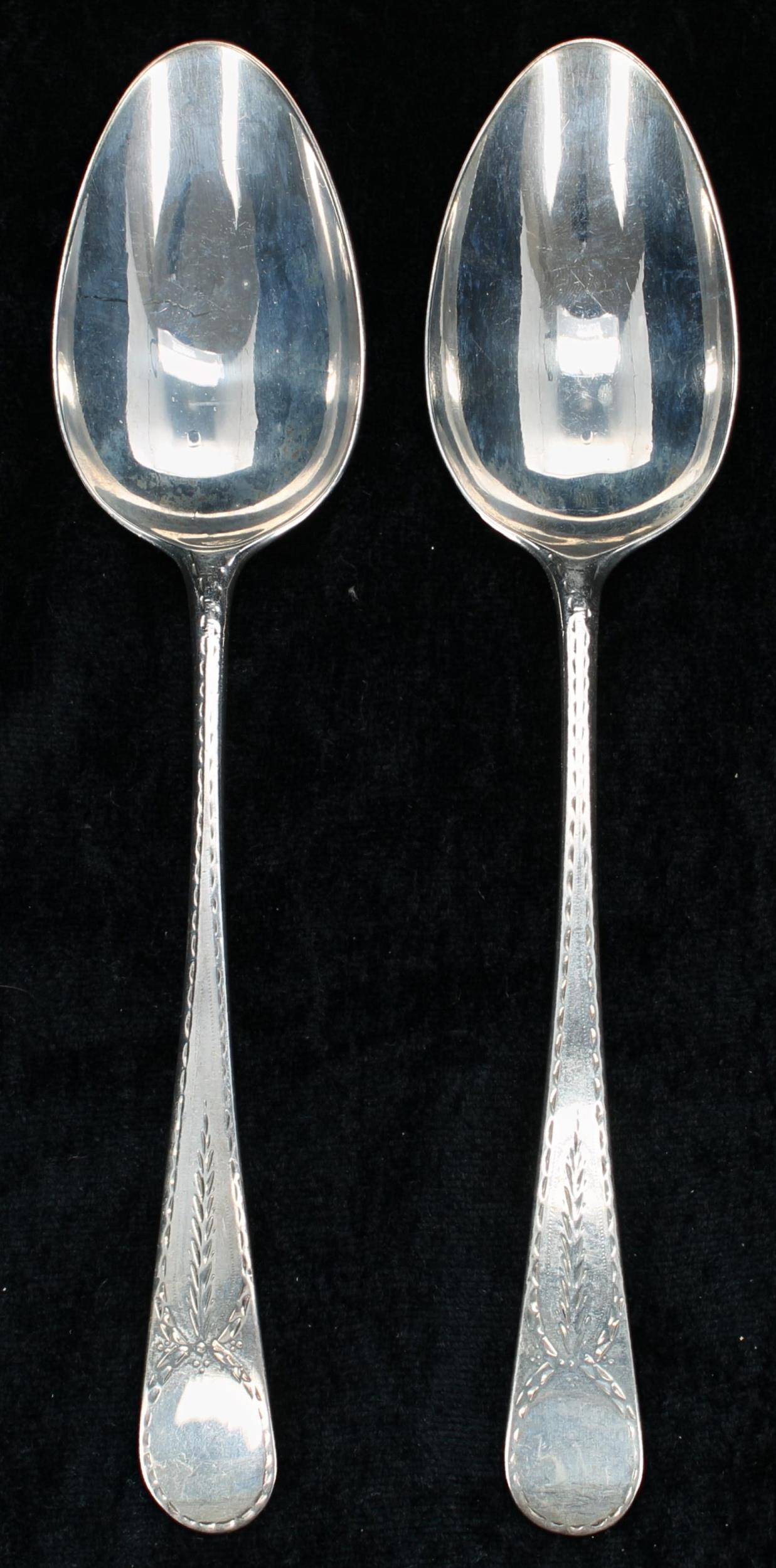 Pair of George III silver table spoons, with engraved borders to the handles, maker 'WS' (possibly