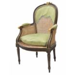 French 19th century bergere chair (fauteuil), with carved and gilded round back over cane and