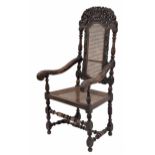 Charles II carved walnut and cane high-backed open armchair, the cresting rail carved with a