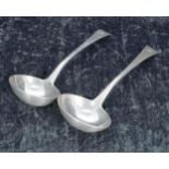 Pair of George III silver sauce ladles, monogrammed to the handles, maker William Eley, William